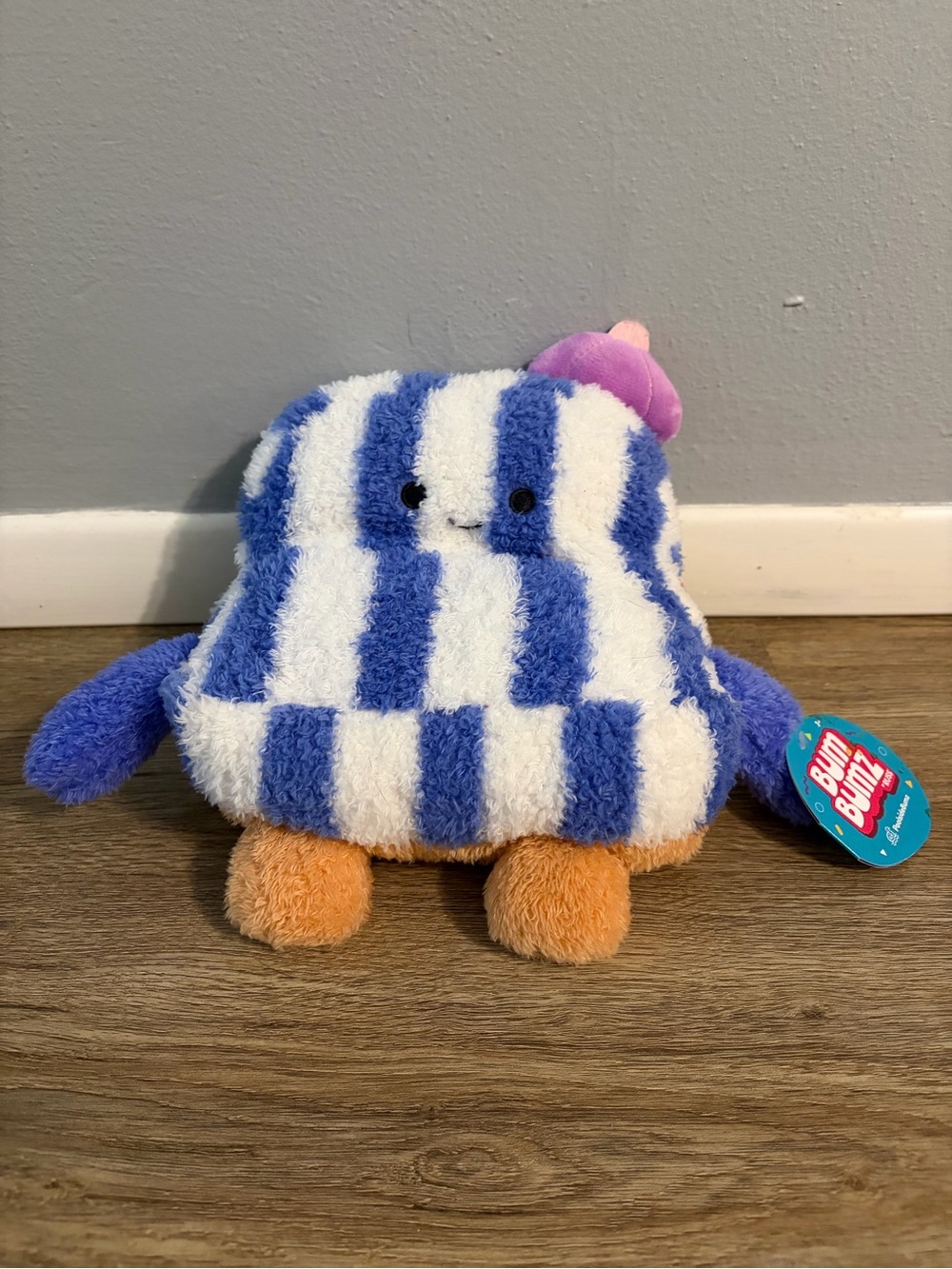 Blue & White Striped Plush Character with Orange Feet